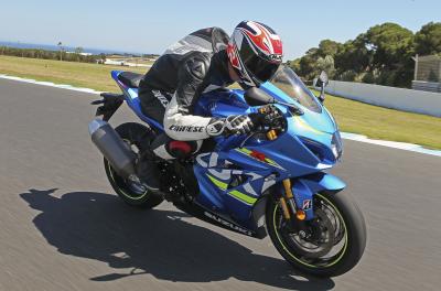 A blue 2017 Suzuki GSX-R1000R being ridden on a track